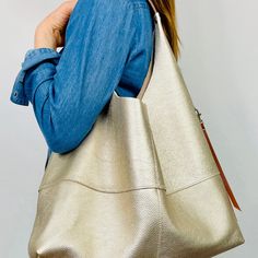 Large Leather Slouchy Hobo Shoulder Bag With Zip Pocket, Champagne Gold - Etsy Modern Gold Hobo Bag With Gold-tone Hardware, Elegant Gold Hobo Bag For Everyday Use, Gold Hobo Bag With Gold-tone Hardware For Daily Use, Gold Hobo Bag With Gold-tone Hardware For Travel, Versatile Gold Tote Bag, Modern Gold Shoulder Bag With Large Capacity, Metallic Shoulder Bag With Removable Pouch For Everyday, Chic Gold Crossbody Hobo Bag, Chic Gold Hobo Bag For Travel