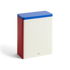 a red, white and blue box sitting on top of a white surface with the lid down