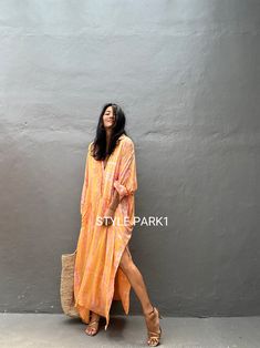 Jimbaran dress  is an oversized long sleeve soft rayon voile Long shirts  dress  .  This Oversized shirt dress is designed to flatter every body type and fit numerous occasions. 👍Included tali - f e a t u r e s - - Relaxed fit - Front pockets Fabric: 100% Soft rayon voile  Style:oversized fit Color:Bali Hand tie dyed peach & multi motif Wash :Hand cool wash  - measurement -  - One size fit all -  I recommend American size M to XL Chest /164cm/ 64inch(round) Length/135cm/53inch Transparent - it' Long Shirt Dress For Beach In Fall, Flowy Long Sleeve Dresses For Beach Cover-up, Oversized Loose Maxi Dress For Spring, Summer Long Sleeve Shirt Dress With Relaxed Fit, Summer Long Sleeve Relaxed Fit Shirt Dress, Relaxed Fit Shirt Dress For Beach In Fall, Long Sleeve Beach Cover-up Dress, Relaxed Fit Long Sleeve Summer Shirt Dress, Oversized Long Sleeve Shirt Dress For Vacation