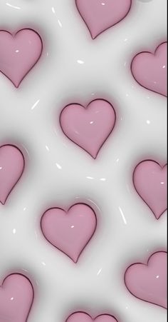 many pink hearts are arranged on a white background