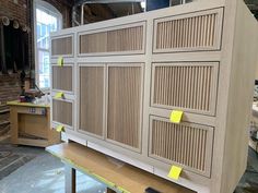 the cabinets are being constructed and ready to be installed in the shop or office area