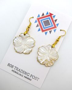 "Genuine Gold Lip Mother of Pearl Hawaiian Style Flower Style Earrings with Gold Plating Hand Made with Stainless Ear Wires Free Shipping.  Vivid colors with some beautiful variations that are natural for the Gold Lip shell used to culture Tahitian Gold south sea pearls.  Earrings are over 1\" in diameter with a drop about 2 inches off the ear.  Accented with gold plating on the edges. Stainless steel ear wires for your safety.  Ships for FREE direct to your home or office." Gold Flower-shaped Earrings For Beach, Gold Flower Earrings For Beach, Gold Lips, Hawaiian Style, South Sea Pearls, Ear Wires, Flower Fashion, Mother Of Pearl, Vivid Colors