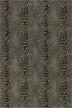 an area rug with black and white dots on it