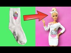 the barbie doll is wearing a hello kitty dress and has her hand up in front of it