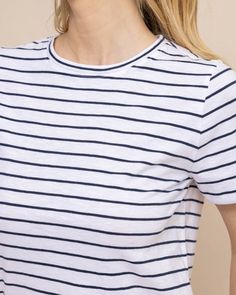 Coastal comfort is easy to achieve in a soft and standard striped tee. This soft cotton crewneck serves as the best base layer for an optimal oceanside outfit. Style: 10819 Navy Horizontal Stripe Crew Neck Top, Relaxed Fit Crew Neck T-shirt With Horizontal Stripes, Striped Nautical Tops For Summer, Nautical Striped Tops For Summer, Navy Cotton Tops With Striped Hem, Navy Cotton Top With Striped Hem, Navy Crew Neck Top With Contrast Stripes, Blue Horizontal Stripe Crew Neck Tops, Blue Crew Neck Tops With Horizontal Stripes