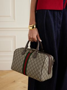 Gucci's 'Ophidia' tote nods to luggage from the house's extensive archives. It's made from monogrammed coated-canvas and trimmed with tonal brown leather and signature green and red webbing. Use yours to carry daily essentials, as well as a water bottle and whatever you're reading. Gucci Tote Bag Outfit, The Row Bag, Gucci Coat, Purse Collection, Chase Bank, Gucci Crossbody Bag, Gucci Tote Bag, Gucci Ophidia, Gucci Crossbody