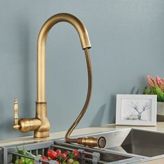 a faucet that is on top of a sink with vegetables in the bottom