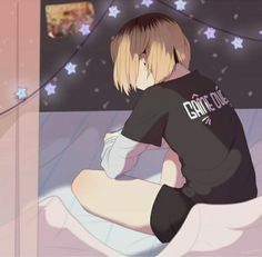 a person sitting on a bed with an anime theme in the background and stars around them