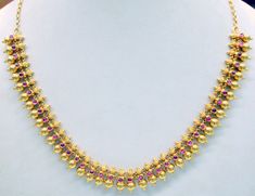 "Vintage 22 karat solid gold spiky design necklace(champakalee har) from rajasthan india. made of solid 22 karat gold and sated ruby color stones. full handcrafted great piece for your jewelry collection. buyer will get gold test report for this item for free. total weight of necklace-38 grams( 1.33 ounce), total lenght of necklace-18\"(we can adjust length),width of necklace-0.8\",material -solid 22 karat gold." Temple Jewelry Ruby Necklaces For Festivals, Ruby Temple Jewelry Necklaces For Festivals, Gold Temple Necklace With Ruby For Celebration, Ruby Temple Jewelry Necklace For Festivals, Celebration Gold Temple Necklace With Ruby, Traditional Gold Ruby Necklaces, Red 22k Gold Round Necklace, Gold Temple Necklace With Ruby Gemstones, Round Gemstone Temple Necklace For Festivals