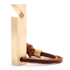 a brown leather bracelet with a wooden clasp