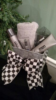 a basket filled with personal care items on top of a counter next to a christmas tree