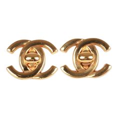 These vintage Chanel earrings of 24K gold plated metal are the iconic CC turn lock with clip on backings. Origin: France Collection: 95ACondition: Vintage; Excellent. Minor scratches. Accompanied by: Chanel box and pouchMeasurements: 1.5" width x 1" height Classic Gold Clip-on Earrings With Logo Plaque, Designer Gold Metal Clip-on Earrings, Gold Formal Earrings With Gold-tone Logo, Luxury Gold Clip-on Earrings With Logo, Classic Yellow Gold Earrings With Logo Plaque, Designer Gold-tone Logo Plaque Earrings For Formal Occasions, Luxury Gold-tone Earrings With Logo Plaque, Gold Classic Clip-on Plug Earrings, Formal Luxury Gold Plug Earrings