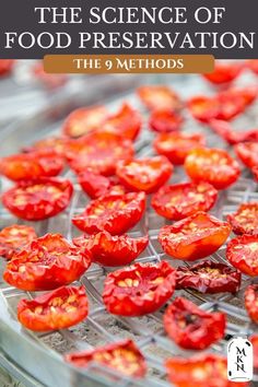 some red tomatoes are on a clear tray and ready to be cut into small pieces