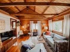 a living room filled with furniture and a fire place