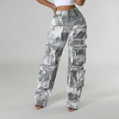 These Revealing Foil Cargo Pants showcase a distinctive washed grey design with oversized pockets that enhance both style and utility. Constructed from resilient fabric, they deliver comfort and adaptability for everyday wear. Material: Crafted from durable, resilient fabric for lasting wear and comfort. Pattern: Features a unique washed grey pattern for a standout look. Pockets: Includes multiple oversized pockets for added functionality and convenience. Design: Versatile design that pairs well Gray Cargo Jeans With Pockets For Spring, Wide Leg Gray Cargo Jeans For Spring, Gray High Waist Bottoms With Pockets, High Waist Washed Black Utility Pants, Gray Bottoms With Multiple Pockets For Streetwear, High Waist Gray Utility Bottoms, Washed Black Utility Bottoms For Spring, Spring Utility Washed Black Bottoms, High Rise Gray Bottoms For Streetwear