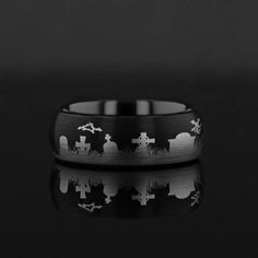 Get into the Halloween theme with this spooky graveyard themed ring. This ring is crafted from our line of Comfort Fit Black Tungsten Carbide Rings with a fun theme. This ring style is available in 4 mm, 6mm, 8 mm, 10 mm and 12 mm, and can be worn as a Wedding Ring, Promise Ring or just for looks! Black tungsten rings are coated with a titanium alloy to make them black, and can scratch off over time. Therefore, the warranty does not cover the coating on black tungsten rings. These can be re-plat Black Tungsten Rings, Black Tungsten, Tungsten Carbide Rings, Tungsten Carbide, Tungsten Ring, Graveyard, Promise Rings, Halloween Themes, Fashion Rings