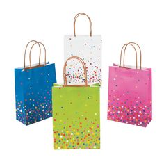 four different colored paper bags with small confetti dots on the front and sides