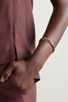 The two intersecting bands of Pomellato's 'Together' bracelet symbolize interconnectedness. It's crafted from 18-karat rose gold and frosted along one bar with scores of diamonds in a rhodium-plated setting. We think it makes a thoughtful gift for someone special. Minimalist Gold-tone Bracelets For Formal Occasions, Timeless Adjustable Gold Bracelet With Polished Finish, Elegant Adjustable Gold Bracelet With Polished Finish, Gold Double Band Bracelet For Formal Occasions, Gold Double Band Bracelets For Formal Occasions, Formal Double Band Jewelry With Modern Twist, Modern Twist Double Band Jewelry For Formal Occasions, Formal Modern Twist Double Band Jewelry, Timeless Rose Gold Bracelet With Polished Finish