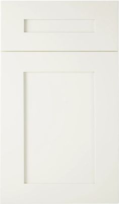 a white kitchen cabinet door with two square knobs on the left and right side