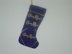 a christmas stocking hanging from a rope with the name crown royal written on it