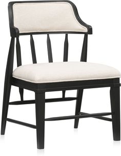 a black and white chair with a cushion on top of it's armrests