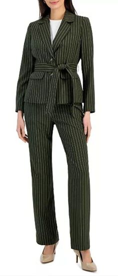 Get ready to slay in this sophisticated Le Suit Petite 2 Piece Suit Set! Perfect for any formal or business occasion, this classic suit features a stylish gray striped pattern that is both slimming and chic. The jacket has a notch lapel style with two-button front button and no sleeve button, while the pants come with a belt and have an inseam of 30 inches. Crafted with woven polyester and satin lining, this lightweight suit is perfect for all seasons - winter, summer, fall, and spring. It comes in size 16P and is suitable for petites. This suit set is brand new with tags and retails for $265. It is the ultimate addition to your wardrobe, so don't miss out! Seasons Winter, 2 Piece Suit, Le Suit, Classic Suit, Suit Separates, Suit Set, Grey Stripes, Summer Fall, Stripes Pattern