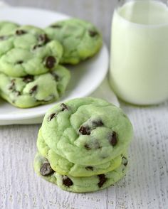 green chocolate chip cookies next to a glass of milk