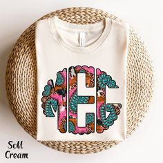 Western Shirt Vintage Monogram Personalization Initial Shirt Cow Shirt For Women Circle Monogram Shirt Western T Shirt Custom Monogram Custom Gift Shirt ✨ PRODUCT DESCRIPTION ✨  This monogram short-sleeve tee fits like a well-loved favorite. Soft cotton and quality print make users fall in love with it over and over again. The shoulders have taping for a better fit over time. Dual side seams hold the garment's shape for longer. ∘ Runs true to size ∘ Heat transfer label ∘ Solid colors: 100% Preshrunk Cotton ∘ Heather Colors: 52% Cotton / 48% Poly ∘ Design colors may differ slightly from the final printed item due to the printing process and monitor calibration. 📏 SIZE 📏 ∘  Adult Unisex sizing. We have a size chart on our listing photos ↑. ✨ ORDER INSTRUCTIONS✨ ∘  In the personalization bo White Cotton T-shirt With Monogram Print, Cotton Monogram Print Graphic Tee, White Monogram Crew Neck T-shirt, Pink Monogrammed Crew Neck Top, Pink Monogram Crew Neck Top, Pink Crew Neck Top With Monogram, White Monogram T-shirt With Crew Neck, White Monogrammed Short Sleeve Top, White Monogram Crew Neck Top