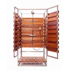 an open shower with wooden slats on the sides