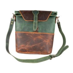 DIMENSIONS: W x H x D: 26 x 31 x 7 COLOR: Green LEATHER TYPE: Vegetable Leather FABRIC: Made from %100 leather. GENDER: Unisex Make a statement with the FIBO Phaselis Green Leather Crossbody Bag. Crafted with 100% leather, this bag boasts adjustable straps to fit any body type, a soft structure, and a secure closure with a flap. Its generous interior gives you plenty of space to store your essentials. Green Leather Bag With Adjustable Strap, Green Leather Shoulder Flap Bag, Green Leather Flap Bag For Everyday Use, Green Leather Shoulder Bag With Leather Handles, Everyday Green Leather Flap Bag, Luxury Green Leather Saddle Bag, Green Leather Saddle Bag With Removable Pouch, Leather Bag With Leather Strap For Everyday Carry, Everyday Leather Bag With Leather Strap