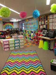 the classroom is decorated with bright colors and pom poms