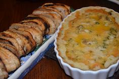 there is a casserole and bread on the table