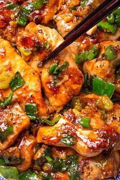 chicken and vegetables with chopsticks in a bowl