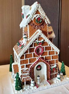 a large gingerbread house decorated for christmas