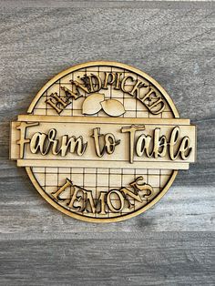 a wooden sign that says, farm to table lemons on the side of a wall