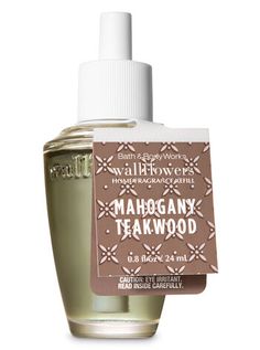 a bottle of mahogany teakwood cologne on a white background