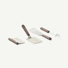 an assortment of kitchen utensils and spatulas