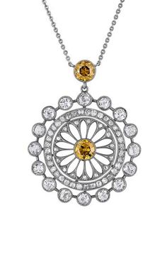 Round-cut brown diamonds center and top this elegant filigree pendant filled with white diamonds and strung upon a dainty 18-karat white-gold chain. 17 1/2" length Total diamond weight: 1.10ct. Color: G–H Clarity: VS 18k-white gold/diamond/brown diamond Made in the USA >Diamond Guide Diamond Jewelry With Intricate Design In Round Pendant, Intricate Diamond Round Pendant Jewelry, Diamond Round Pendant With Intricate Design, Elegant Medallion Diamond Necklace With Diamond Accents, Luxury Silver Diamond Filigree Necklace, Luxury Silver Filigree Diamond Necklace, Luxury Diamond Pendant Necklace With Rose Cut, Luxury White Gold Diamond Necklace With Filigree, Diamond Filigree Round Pendant Jewelry