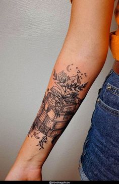 a woman's arm with a tattoo on it that has books and flowers on it