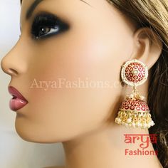 Rajasthani Meenakari Jhumka Earrings with Pearl beads Premium Quality Kundan Jhumka Earrings Length: Approx. 2.5" Light-weight Push-Back closure Gold Finish on high-quality brass as the base metal, Kundan stones and Pearls Suitable for any traditional or contemporary attire and occasion In-stock & ready-to-ship **Color may vary slightly due to photography and lighting. Meenakari Bridal Earrings For Puja, Bridal Meenakari Earrings For Puja, Red Cutdana Earrings For Puja, Red Meenakari Earrings For Puja, Kundan Jhumka Earrings, Kundan Jhumka, Jhumka Earrings, Green Bead, Base Metal