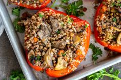 stuffed bell peppers with lentils and mushrooms on a baking sheet, ready to be eaten