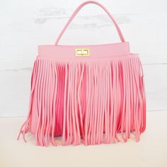 Are feeling the fringe? Theres nothing like a fringe statement handbag to bring a cute outfit together! This bag is a soft vegan leather with gold hardware and 3 zipper compartments. Each of these handbags can easily convert from a handbag to a crossbody bag with just a swap of a strap! Free shipping & Free gift included with purchase! Chic Tote Shoulder Bag With Tassels, Chic Crossbody Hobo Bag With Fringe, Trendy Fringe Satchel Shoulder Bag, Chic Fringe Crossbody Shoulder Bag, Chic Fringed Crossbody Hobo Bag, Trendy Fringed Satchel Shoulder Bag, Chic Tassel Tote Shoulder Bag, Chic Fringe Hobo Bag, Chic Rectangular Fringe Shoulder Bag