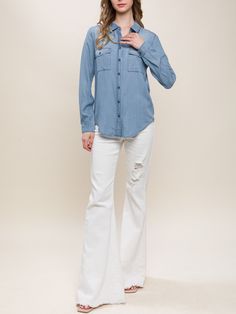 "Introducing our stylish and eco-friendly Long Sleeve Jean Shirt! Made from soft Tencel fabric, this denim blue and white button-up shirt is the perfect addition to your spring, summer, and fall wardrobe. With double pockets and a timeless design, it's perfect for casual outings, vacations, and even resort wear. Upgrade your wardrobe with this versatile and sustainable piece today Super Soft Denim Blouse Available in White and Washed Denim from Small to Large Size. Non Stretch. Regular Fit.  Please check our US number size regarding our S/M/L: Small (US 2-4), Medium (4-6), Large (6-8) Model is Wearing Size Small. Model: 5'9\"  32B bust, 25\" waist, and 36\" hips.  Color may vary slightly due to monitor resolution  100% Tencel NO REFUNDS-please check sizing, Buyer must pay exchange shipping Washed Blue Denim Button-up Shirt, Medium Wash Button-up Denim Top With Buttoned Pockets, Washed Blue Chambray Button-up Top, Blue Chambray Button-up Denim Jacket, Relaxed Fit Washed Blue Button-up Denim Top, Washed Blue Relaxed Fit Button-up Denim Top, Relaxed Fit Washed Blue Denim Button-up Top, Light Wash Denim Top With Buttoned Pockets, Medium Wash Chambray Button-up Blouse