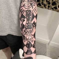 a man with a black and white tattoo on his arm that says beat the odds