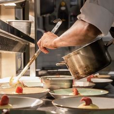 a chef is preparing food in the kitchen