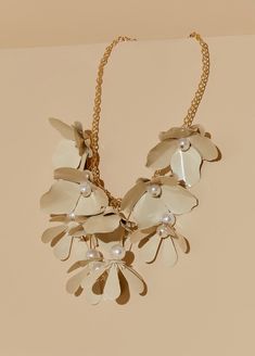 Metal flowers are given a pop of refinement with faux pearls accented by gold tones for an exquisitely crafted necklace. Flower Statement Necklace, Cocktail Jewelry, Faux Pearl Earrings, Faux Pearl Necklace, Metal Flowers, Ceramic Jewelry, Pearl Size, Metal Necklaces, Gold Flowers