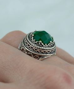 Sterling Silver Filigree Art Green Agate Gemstone Women Bold Ring Ring Face Length is 0.75 inches and Width is 0.75 inches Green Agate Gemstone is 12 mm and faceted checkboard, round-cut. This metal embroidery filigree ring is oxidized and highly polished. Filigree is made of delicate metal strands that have been skillfully fashioned to create an outstanding combination of old and modern art. Originating in Mesopotamia, Anatolia. It is made of delicate metal strands that have been skillfully fas Emerald Filigree Ring Gift, Emerald Ring With Filigree For Gift, Round Emerald Ring With Filigree For Gift, Round Emerald Ring With Filigree As Gift, Elegant Silver Emerald Ring With Natural Stones, Metal Embroidery, Bold Rings, Silver Polish, Art Green