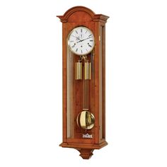 a wooden grandfather clock with two bells on each side