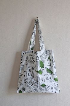 Field Bird Soft tote bag with storage pouch with fresh birdies and leaf pattern. Practical, beautiful and handmade with love. It has a pattern that varies from front and back as shown in the pictures. Perfect for shopping as this tote comes with a storage bag so you can keep it in your handbag and bring it out whenever you need it. Reusing with style! 100% cotton and washable. Measurements: 37 cm x 37 cm, Handles 28 cm high. Do see more delightful items our my Etsy shop: www.etsy.com/uk/shop/Luc Rectangular Bags With Plant Print For Daily Use, Cotton Bags With Plant Print For Daily Use, Cotton Bags With Plant Print For Everyday Use, Everyday Rectangular Bag With Plant Print, Everyday Tote Bag With Plant Print, White Bag With Plants Print For Daily Use, White Bag With Plant Print For Daily Use, White Bags With Plant Print For Daily Use, Everyday White Bags With Plants Print