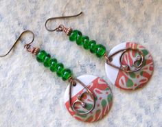 A different twist to your usual holiday earrings featuring green and reddish coral enamel charms. The abstract pattern on the enamels reminds me of a tree branch. I have paired them with spiraling green lampwork beads and copper beads. I have accented them with teardrop shaped copper components. These unique earrings measure 2 1/2 inches in total length and hang on niobium earring hooks. All pieces come boxed ready for gift giving or keeping for yourself. Return to shop: bstrung.etsy.com More li Green Earrings For Jewelry Making, Green Drop Earrings With Unique Variations, Green Bohemian Earrings With Unique Variations, Bohemian Green Jewelry For Holiday, Green Spiral Earrings As Gift, Blue And White Earrings, Lampwork Bead Earrings, Bohemian Christmas, Lampwork Earring